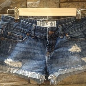 PINK by VS distressed cut offs